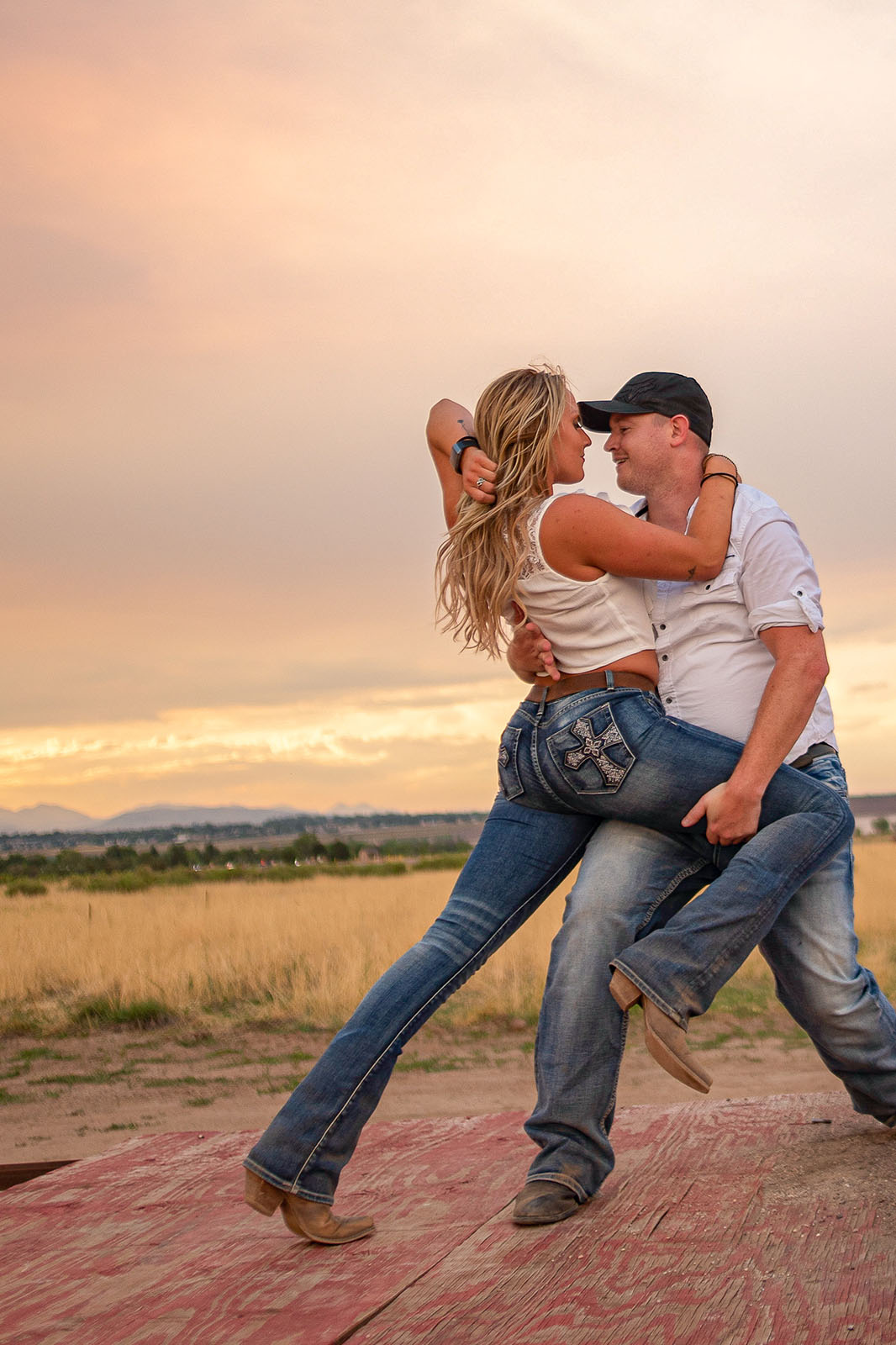 A couple dancing together at home